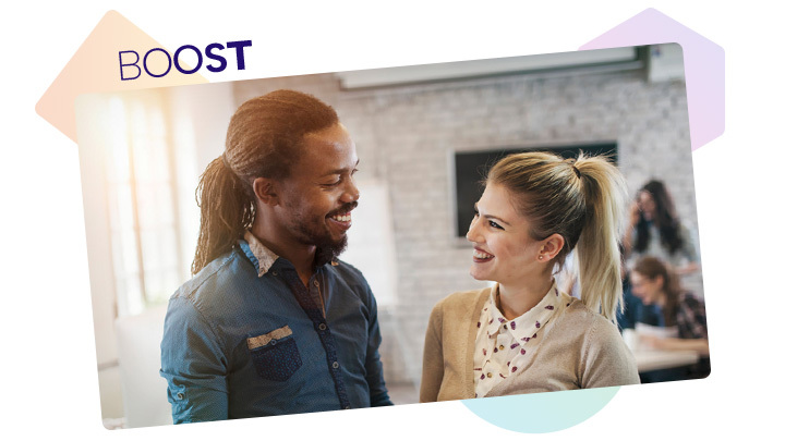 Man and woman smiling at each other with Boost logo in corner of image