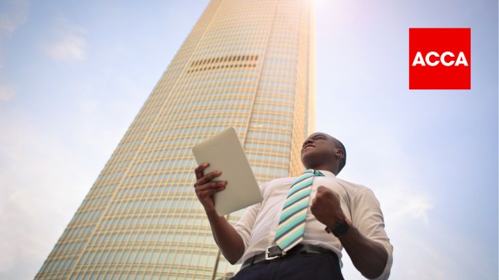 Man standing by skyscraper with ACCA logo in corner of image