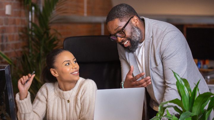 Man and woman talking at work