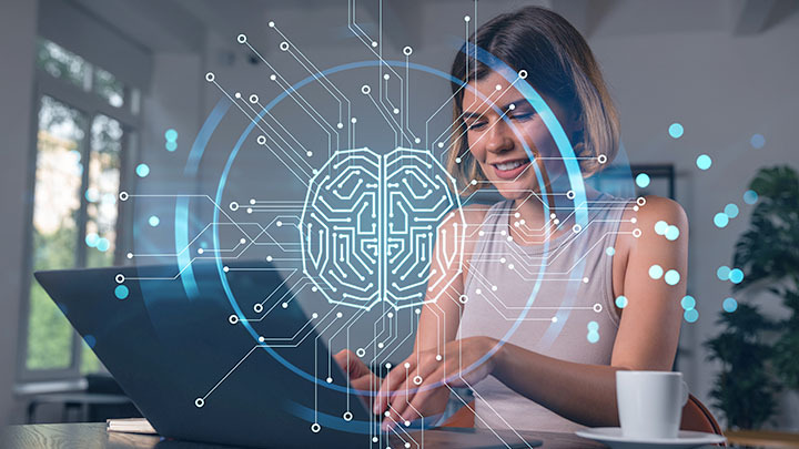 Woman on laptop with brain graphic over the top