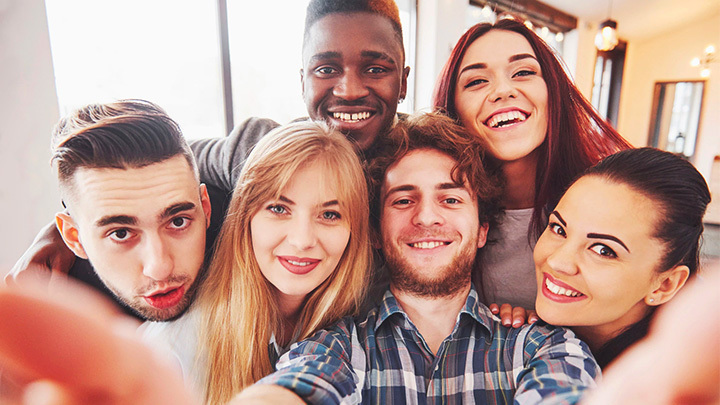 Group of young people taking a selfie