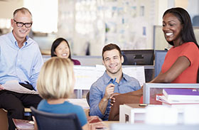 Group of people in an office talking