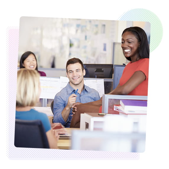 A group of people sat in an office and talking