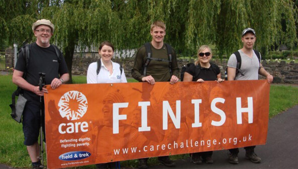 Three men and two women at the finish line for the Care challenge