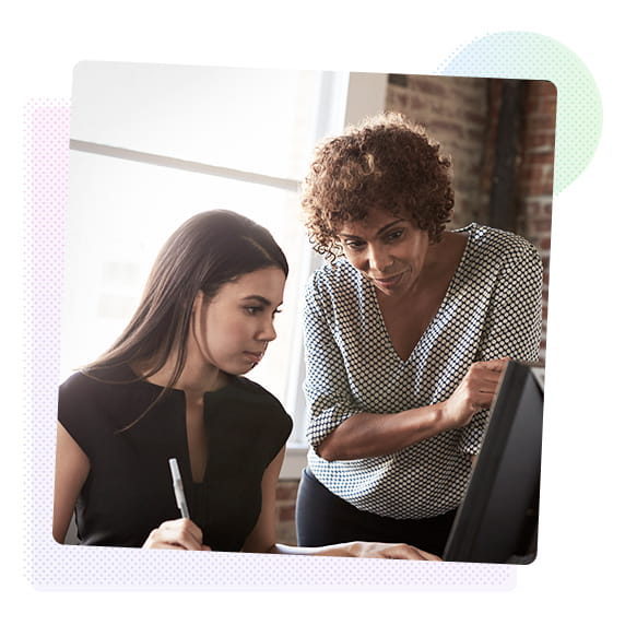 Two women looking at a computer screen