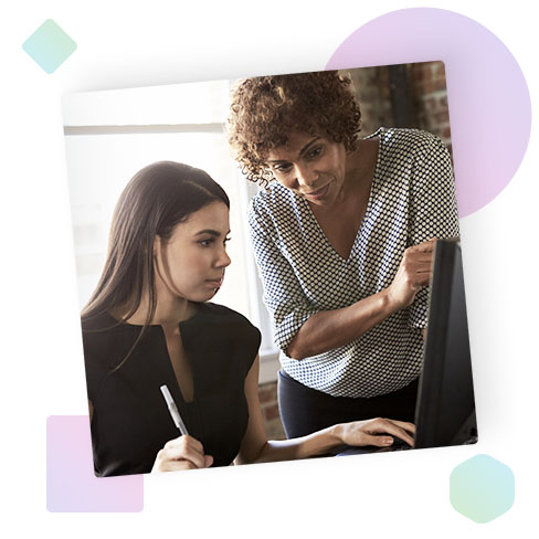 Two women looking at a computer screen