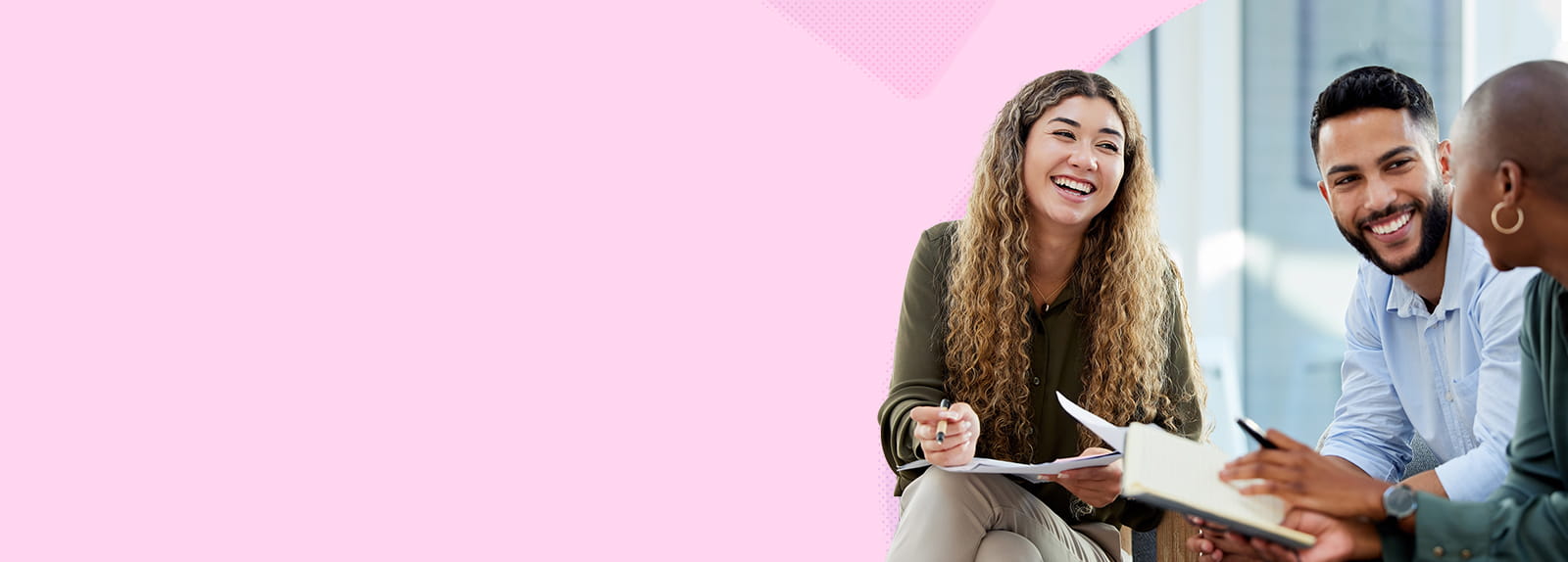 A man and two women sitting and talking