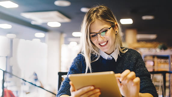 A woman using a tablet device