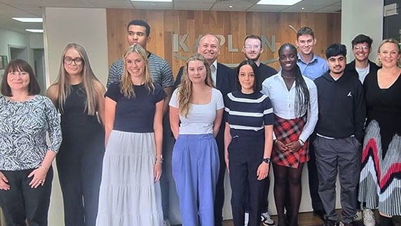 Group photo with MP Neil Coyle (centre) and Jenny Pelling, Kaplan's Director of Skills and Strategy (far right), with apprenticeship learners from Greater London.