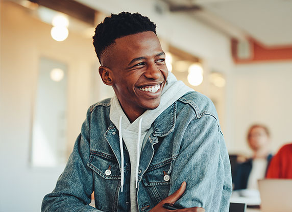 Man smiling over shoulder