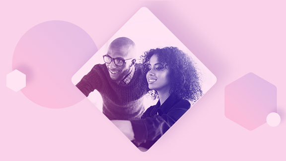 Two men and a woman looking at a computer screen