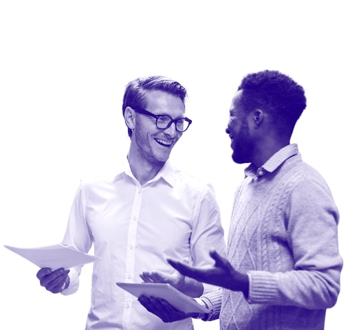 Two men talking and smiling