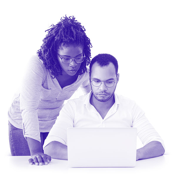 A woman and a man looking at a laptop