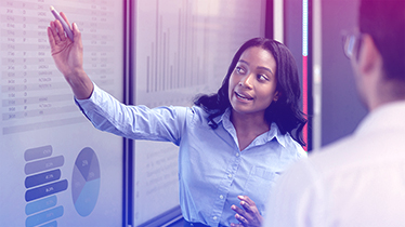 Woman holding a pen up to a board