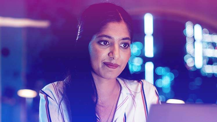 woman looking at a laptop screen