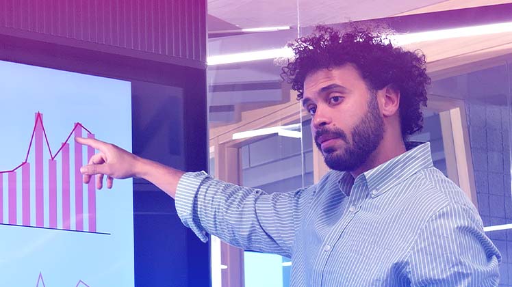 Man pointing to board