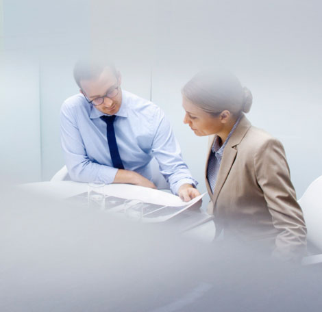 Man and woman reviewing a portfolio