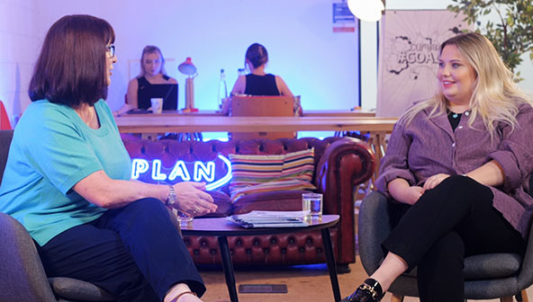 Kathy Walton sitting and talking with Kelsey Haslam