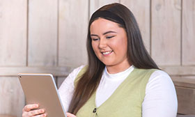 Woman holding a tablet device