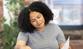 Woman looking through a textbook