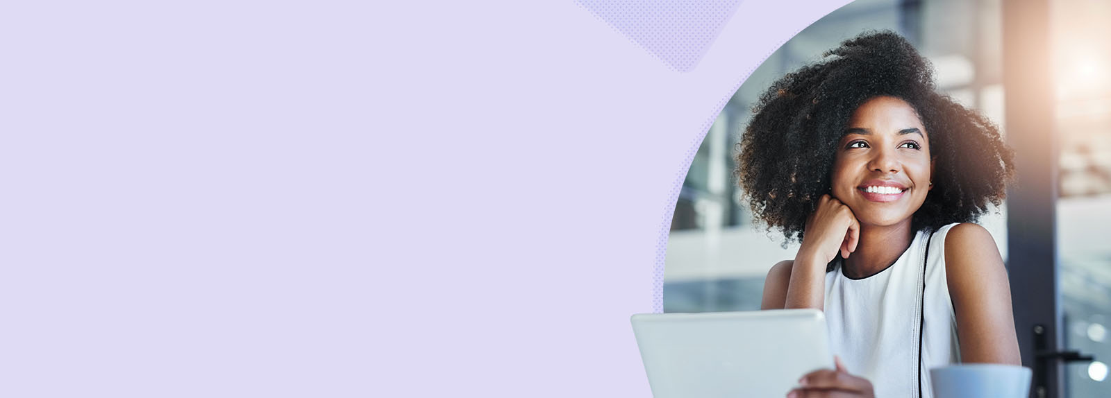 Woman in fron t of a laptop looking off to the side