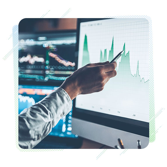 A hand pointing at a chart on a screen