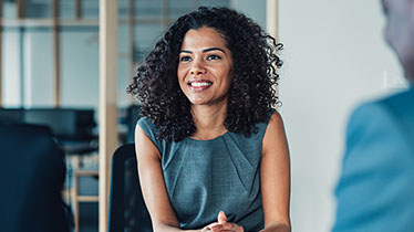 Woman smiling during meeting