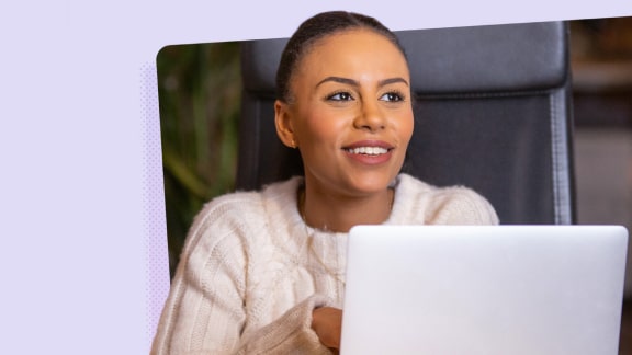 Smiling woman using a laptop