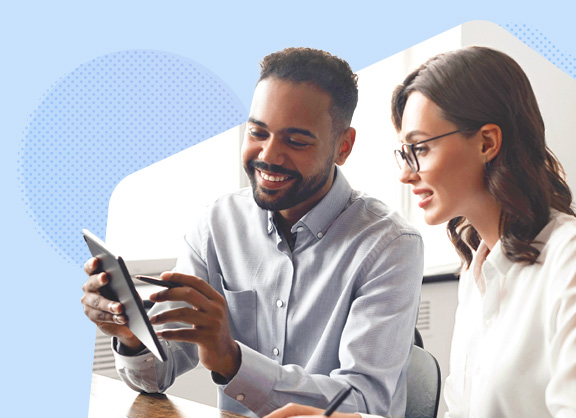 Man showing something on a tablet to a woman