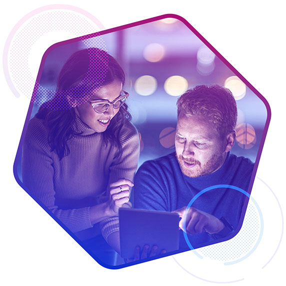 Man and woman looking at a laptop screen