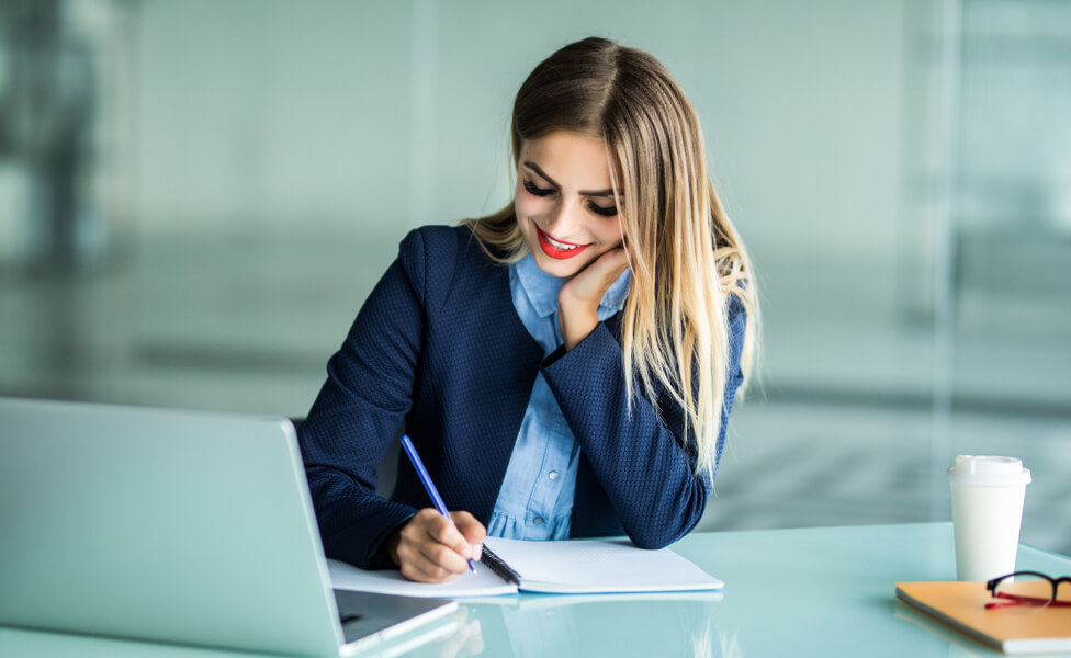 A woman looking at a laptop