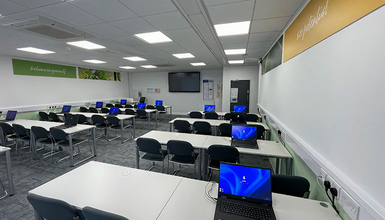 Classroom with laptops in Kaplan Cambridge centre