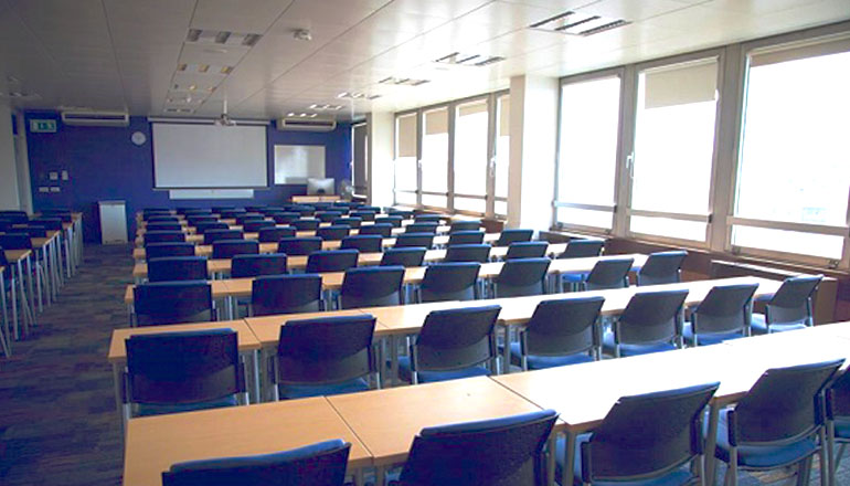 Chairs and vending machines in breakout area