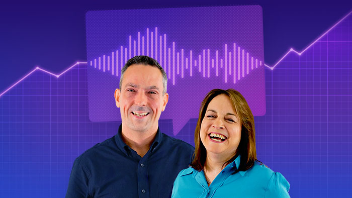 Lee Rowlandson and Caron Betts smiling and standing in front of a purple background with a graphical line going up and a speech bubble with a sound wave inside