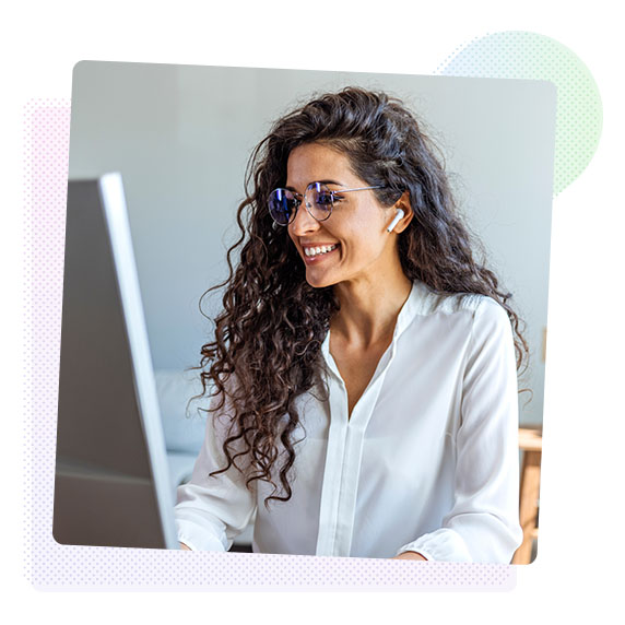 Woman smiling working on a computer