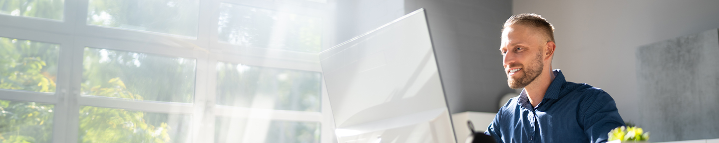Man looking at a computer monitor