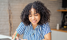Woman holding a pen and calculator