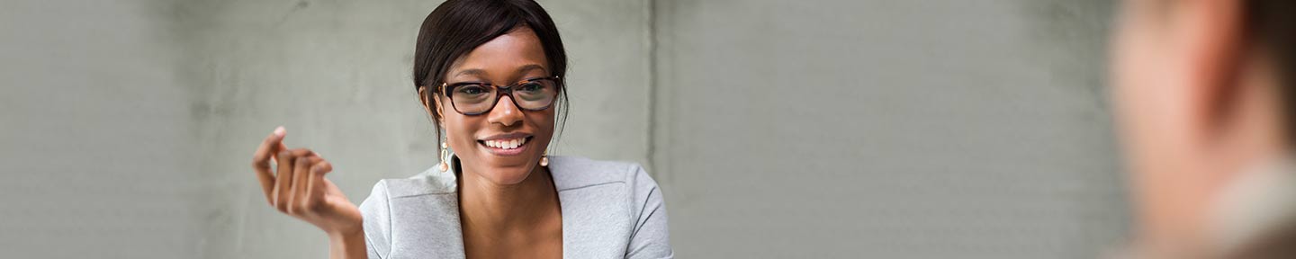 A lady having a discussion with a man