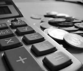 Coins next to a keyboard
