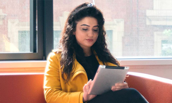 A woman wearing pink and smiling